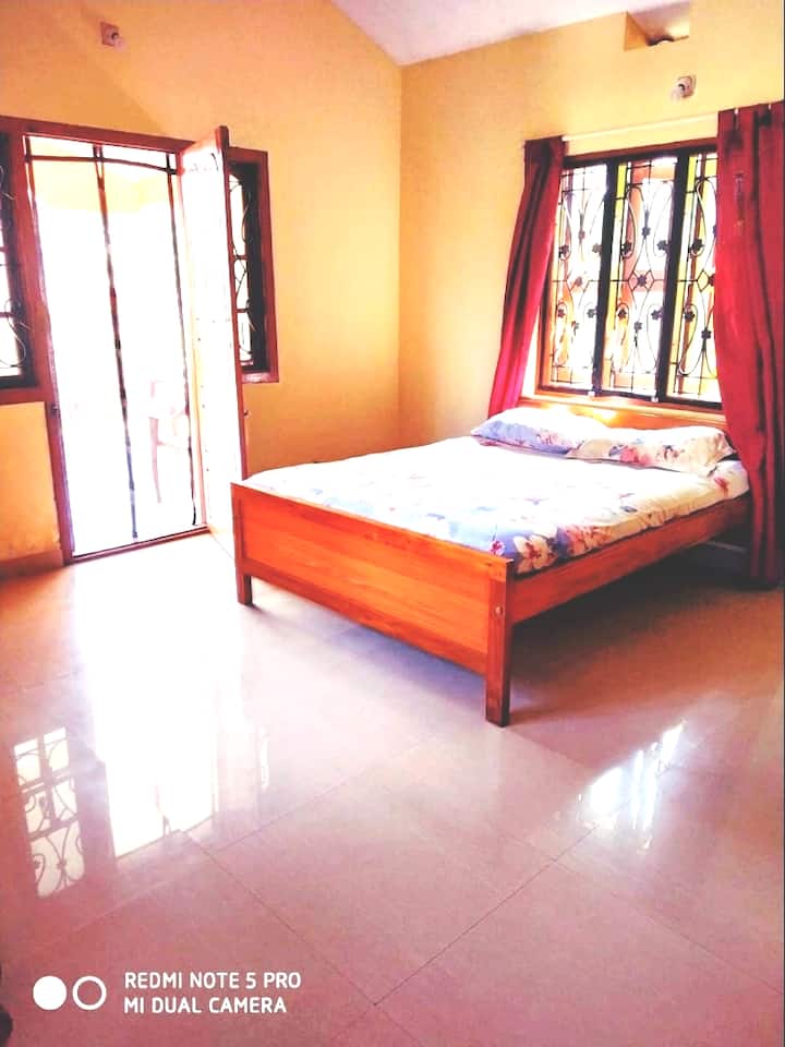 This is the first bedroom which comes with attached private bathroom and a balcony with beautiful view.
The windows and doors come with magnetic Mosquito mesh so your stay is a comfortable and relaxed one !
Fresh and Clean bedsheets and Linens are provided!