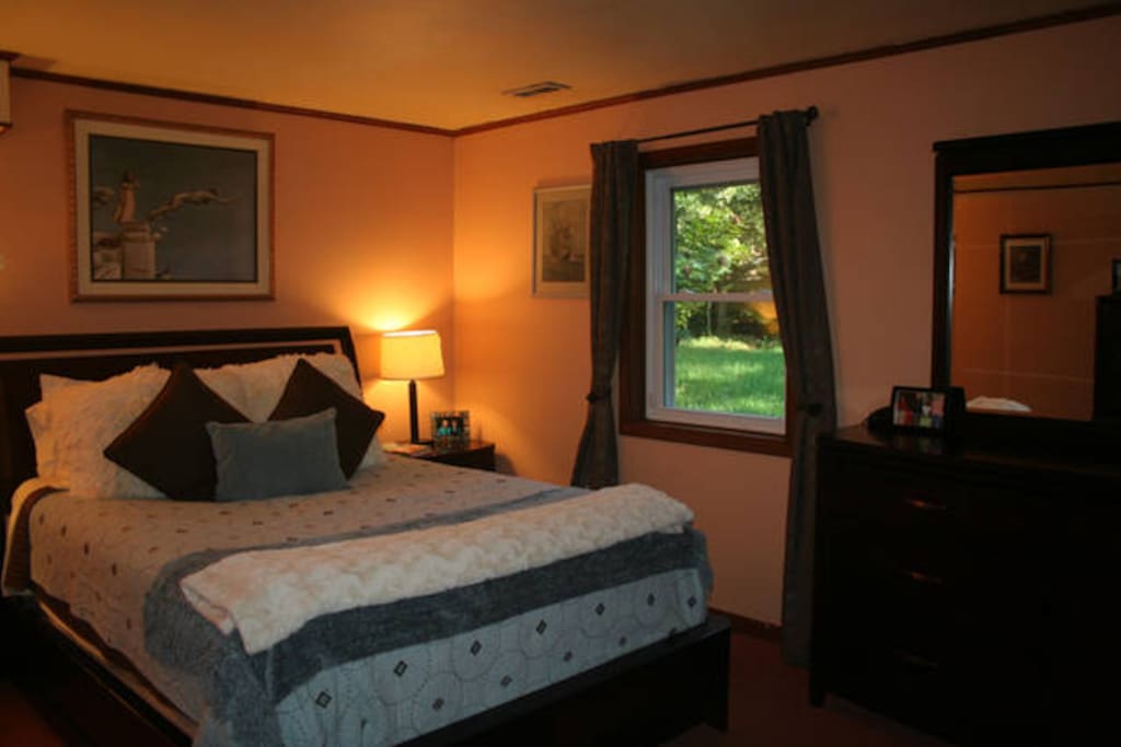 Private bedroom with queen size bed, dresser & closet.