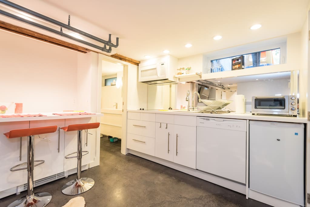 Full kitchenette with microwave, dishwasher, stove top and toaster oven