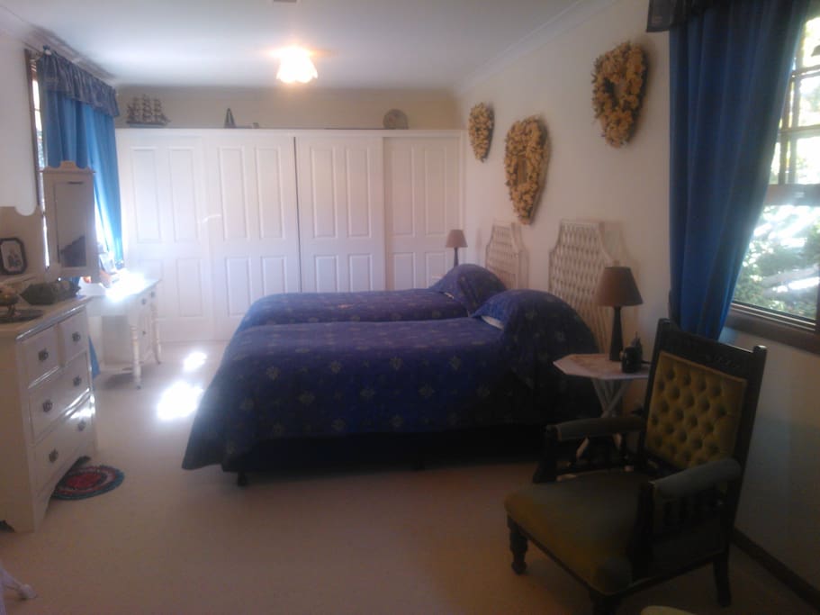 Spacious bedroom includes own television