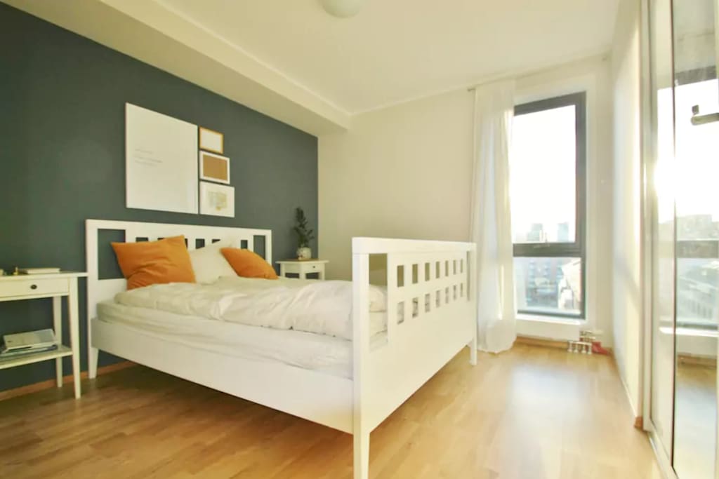 Bedroom 1. Queen size bed and view of Oslo's skyline.