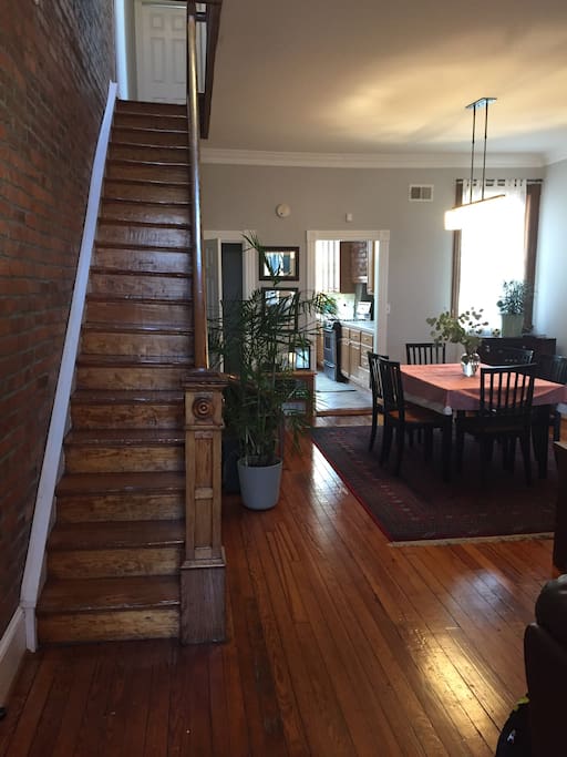 Main level - Exposed brick wall and original woodwork create wonderful ambiance.