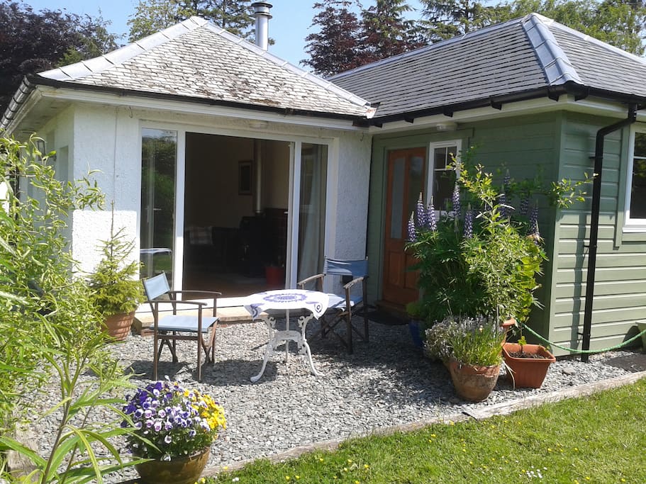 Sunny day - bedsit opens fully to garden terrace