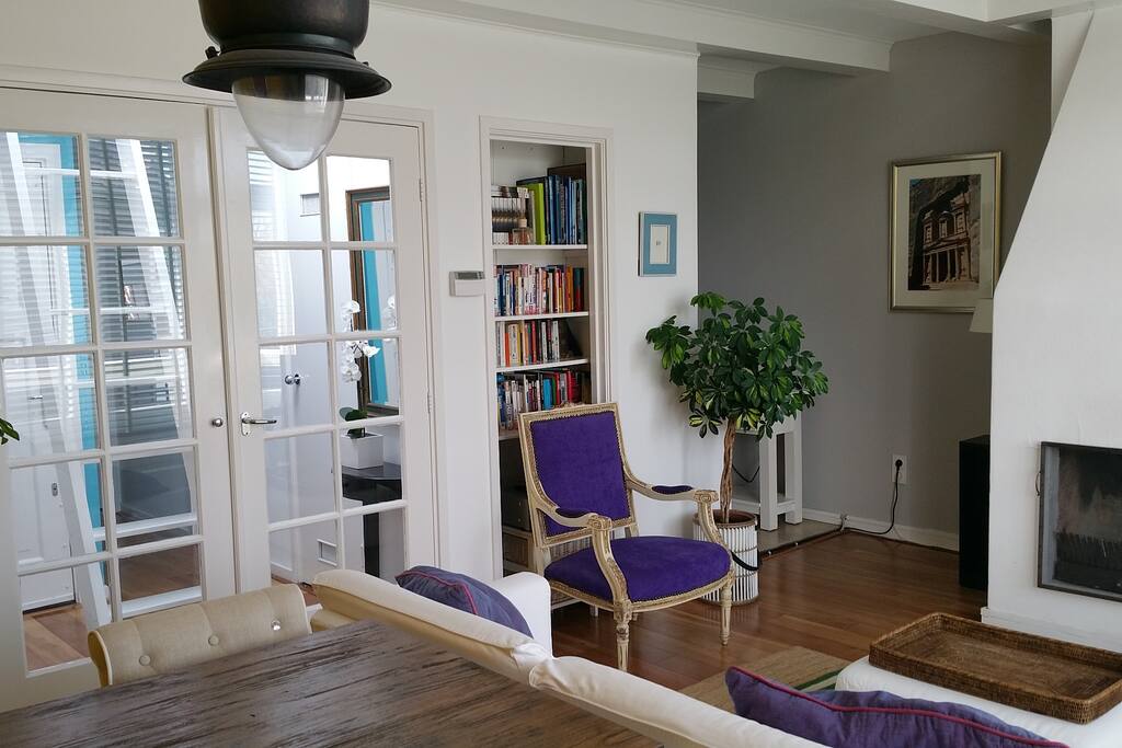 Living room with hall (left) and way to kitchen (right)