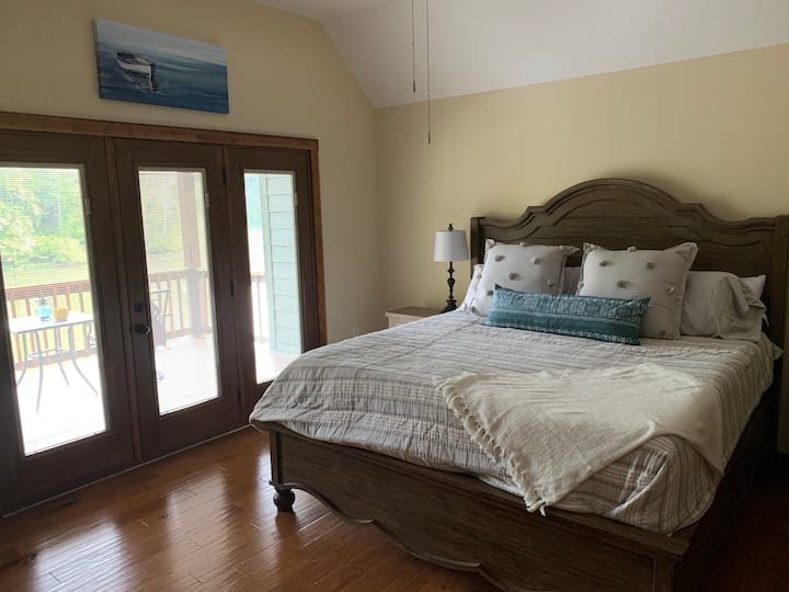Master bedroom boasts a king bed, TV, tons of closet space, and a PRIVATE, covered deck overlooking Lake Malone.