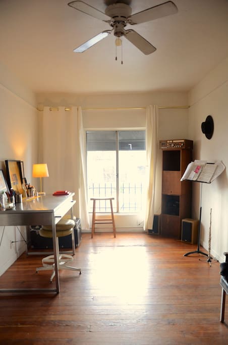 Spacious metal desk, music stand for those who plays music, wide long window