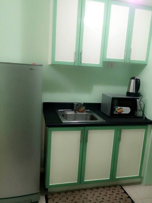 We provide you with microwave and electric kettle. We do not encourage cooking inside the unit to maintain the freshness of the unit.