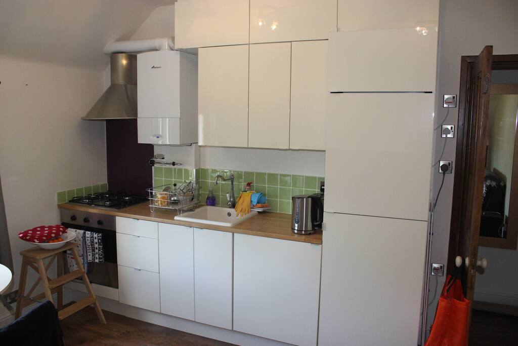 Kitchen - fridge, freezer, small dishwasher, oven, sink etc