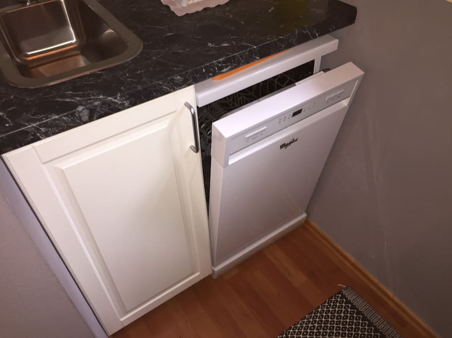 Whirlpool dishwasher under kitchen sink.