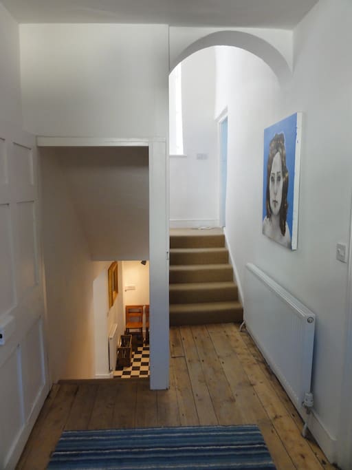 Entrance hall with stairs to lower ground floor kitchen and stairs to first and second floors