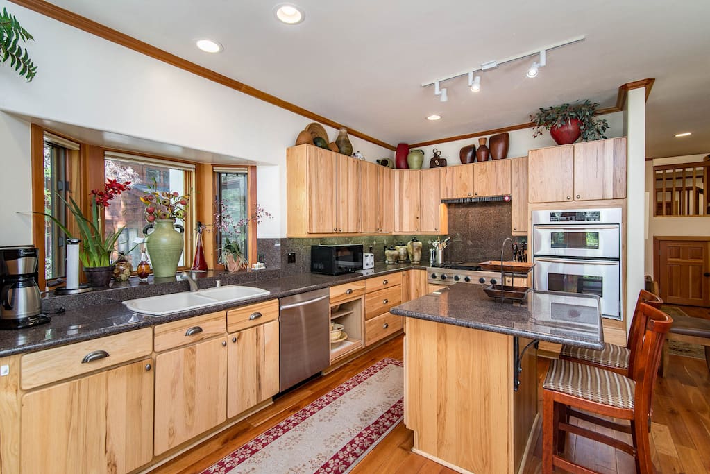 The roomy kitchen is fully equipped with all the appliances and cooking essentials you need.