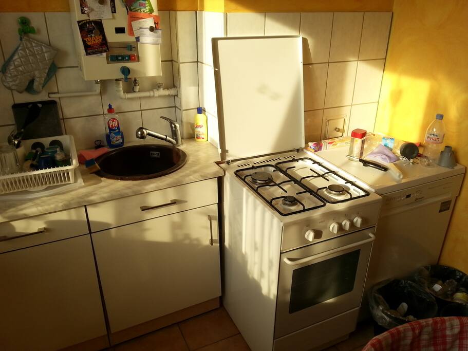 Particular of the kitchen captured while wrapped by an unexpected wave of warming yellow