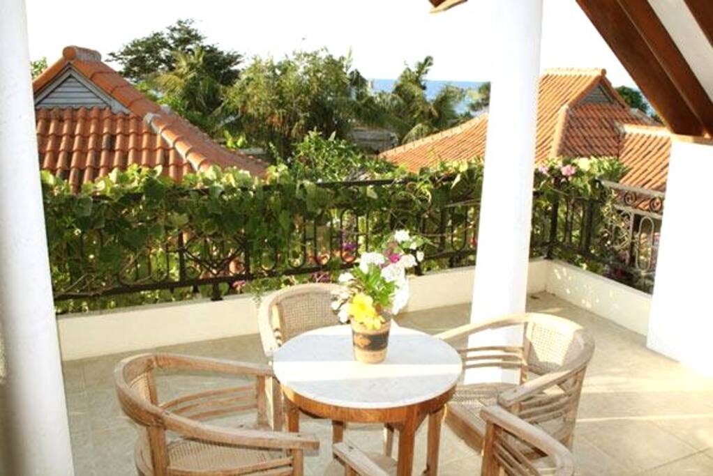 Balcony overlooking garden and the sea