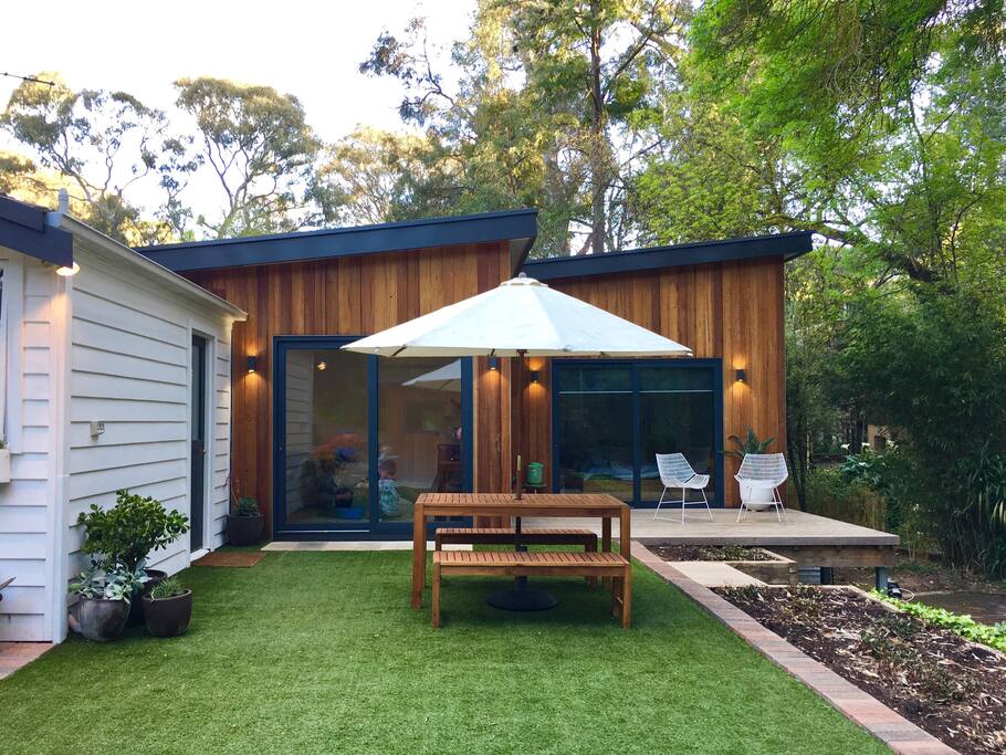 Second outdoor entertaining area. Great area for the kids to run about whilst you relax with a glass of wine. The second sitting room / playroom & master bedroom overlooks this area.