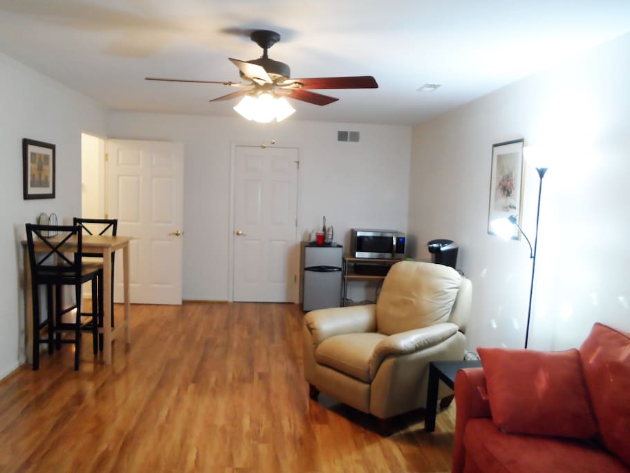 Spacious living area with Flat screen TV, CD and video player.