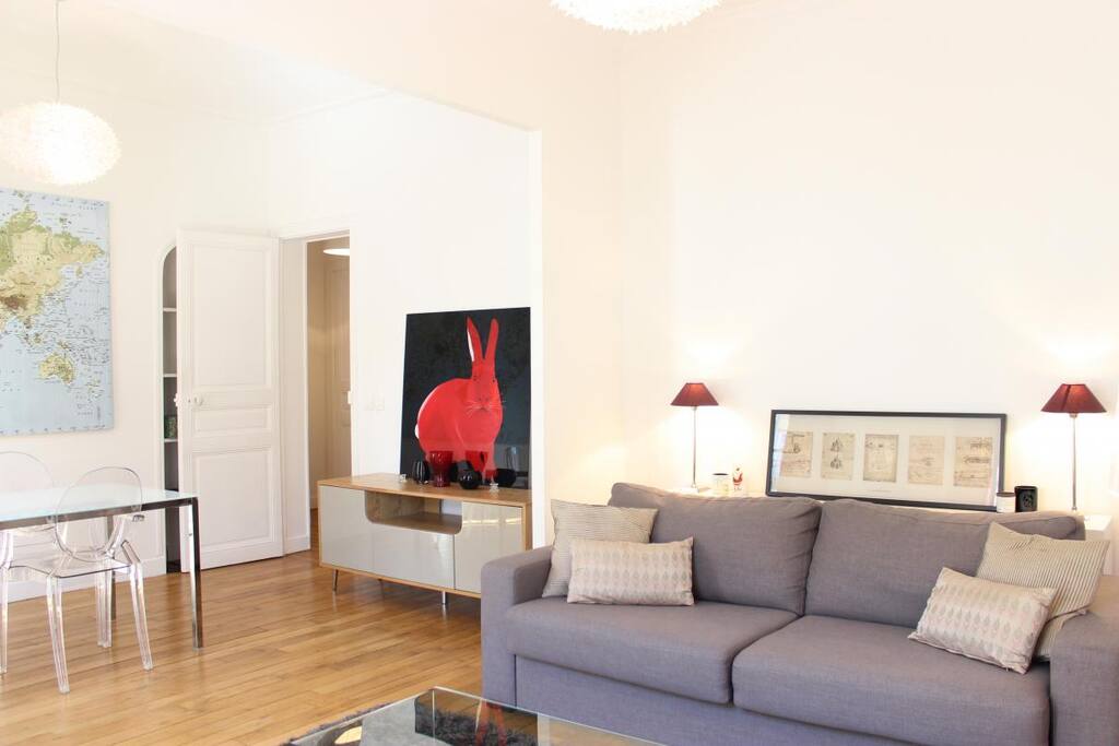 LIVING:The 13 square meters living room has a double glazed window facing street . It is equipped with : double sofa bed, coffee table, TV, 2 armchairs, built-in wall closet, hard wood floor.
