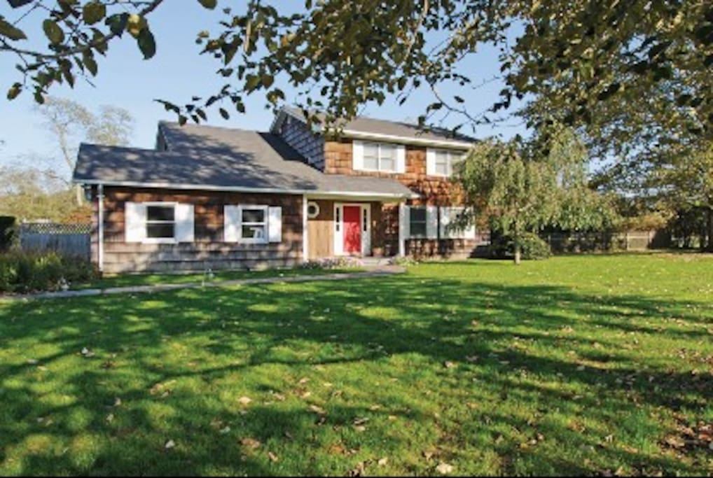 Front of the house; it sits on one acre of lawn & trees