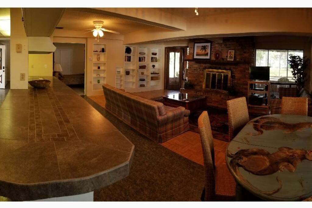 Living room & kitchen opening to porch, oak room with stairs to mb behind