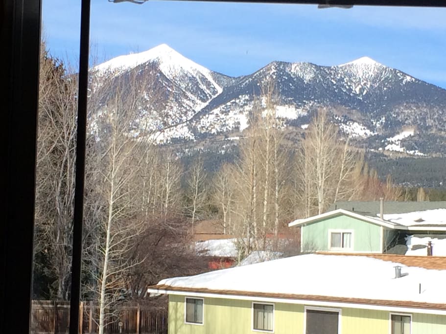 The mountain topped with snow. View from the room.