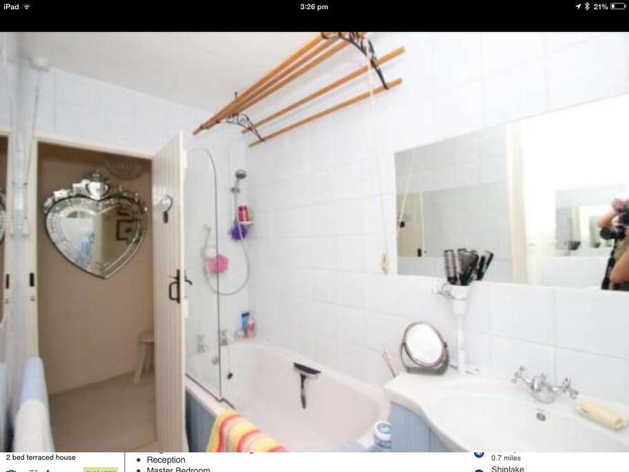 Bathroom with shower over bath.