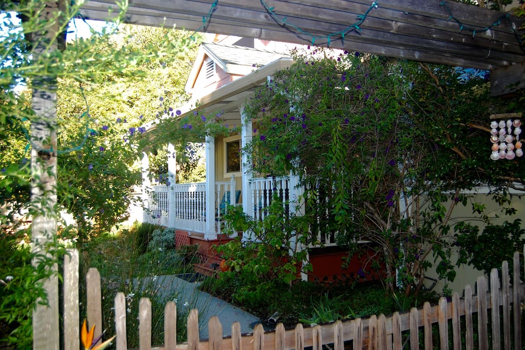 The house is set back from the street tucked in a cozy corner.