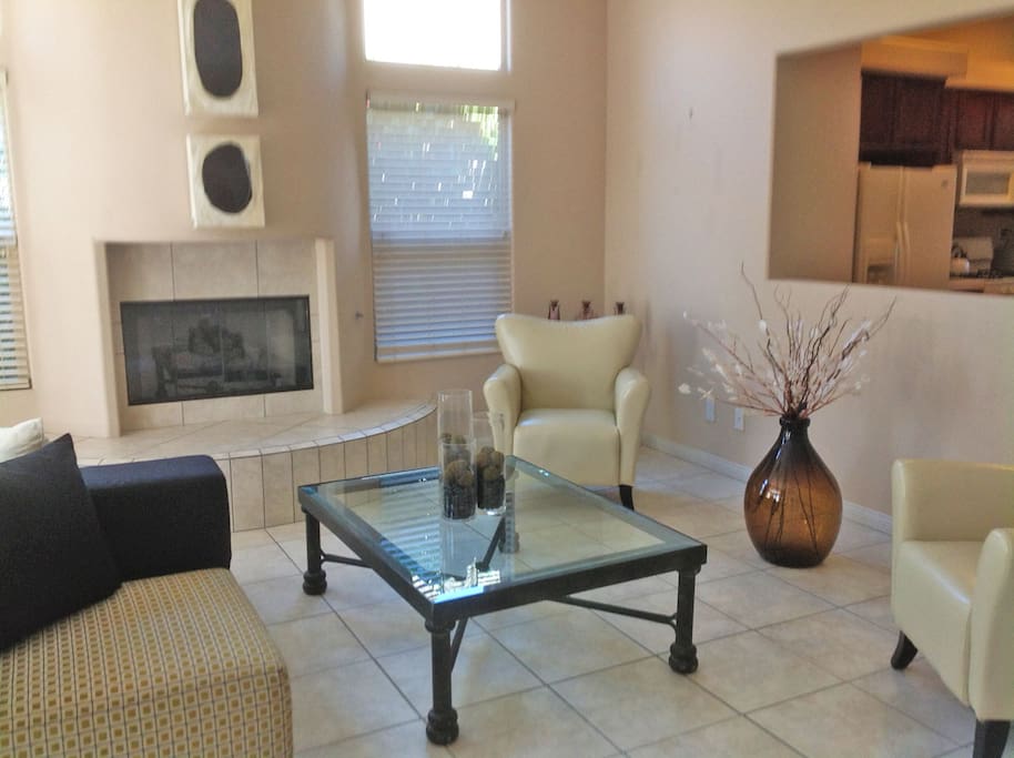 contemporary living room with bay doors out to pool