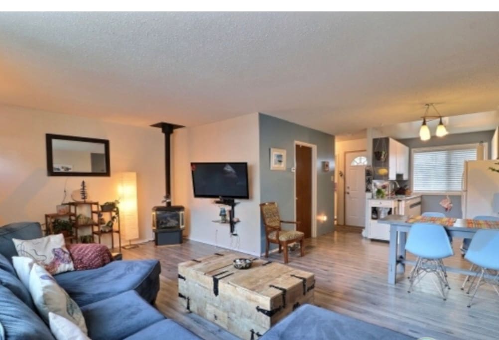 Cozy living room with a propane stove and TV, available with Netflix.