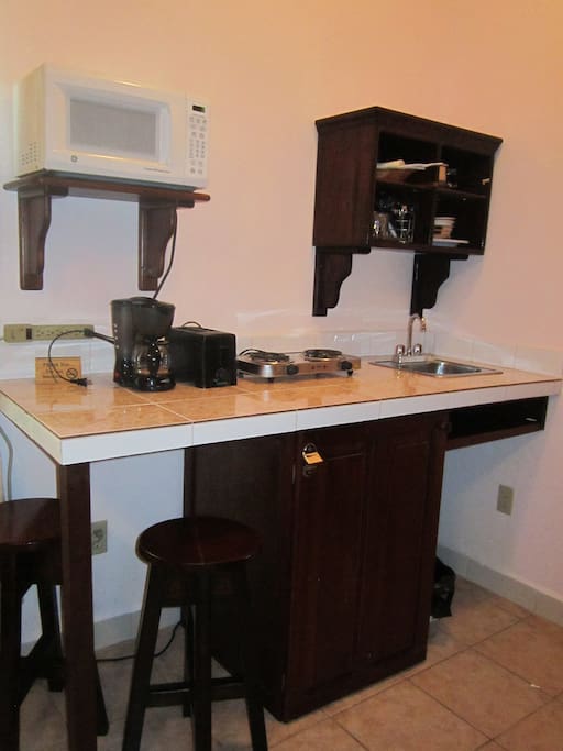room with a mini kitchen