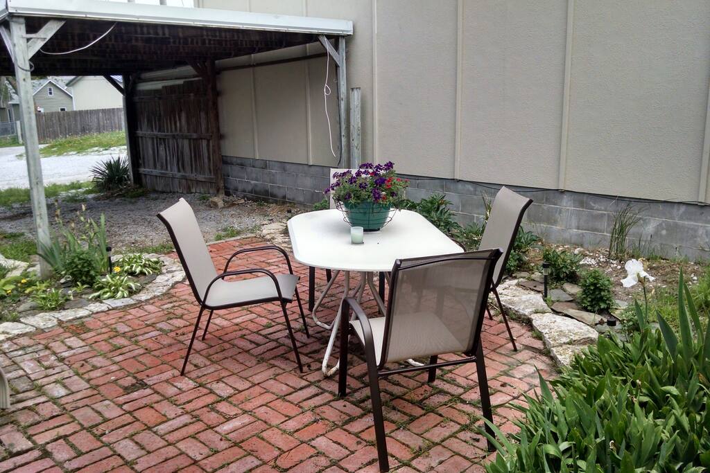 Off-Street parking in the back with a car port and garden area