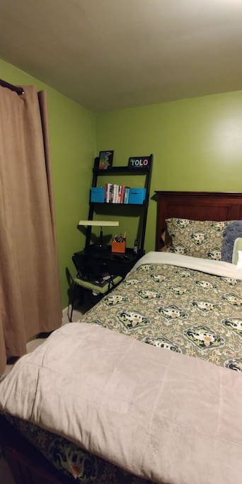 Small desk beside bed
