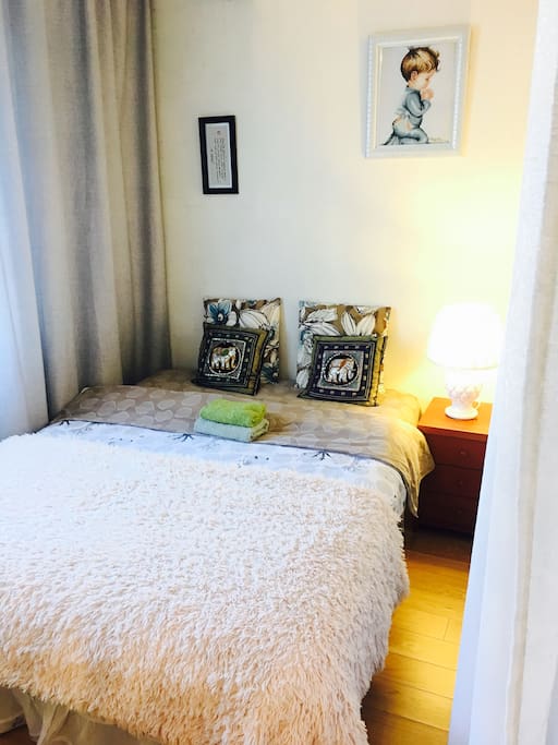 Double bed , comfortable mattress by the window