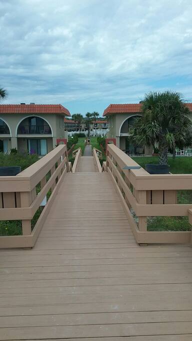 View walking towards complex from beach