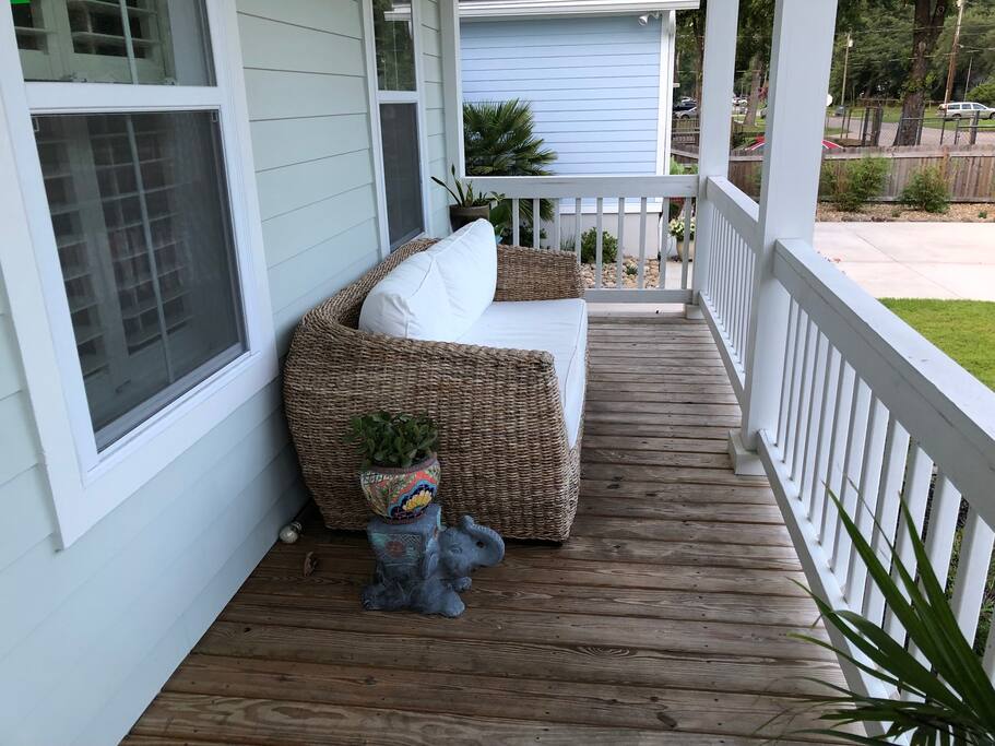 Another angle of the spacious front porch and couch with enough room for 4 people comfortably