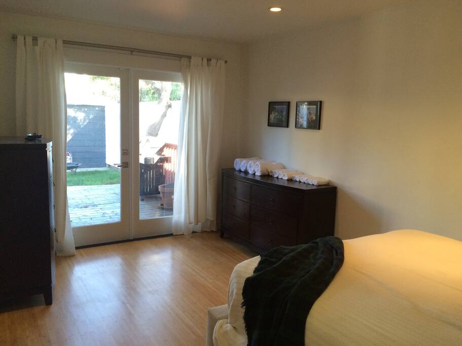 French doors leading to the back porch and yard and two dressers for you to store clothes in.
