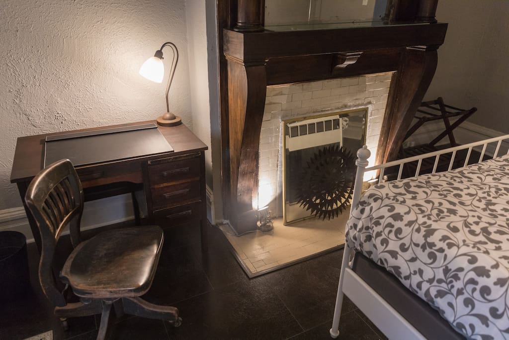 Unwind and inspire at this vintage desk. There is a multi-plug for your electronics.