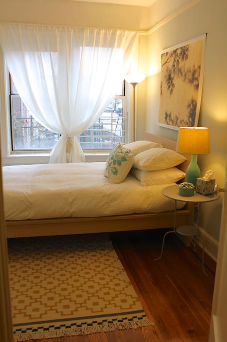 Sunny, calming, and quiet bedroom.