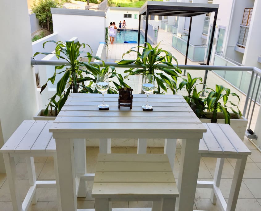 Sitting on the front balcony facing the pool and RELAX!