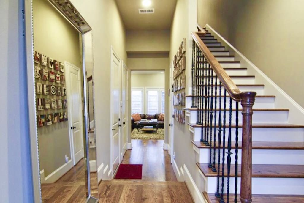 Exquisite Inviting entry into the modern townhouse with first floor living area and all natural hard wood flooring!
