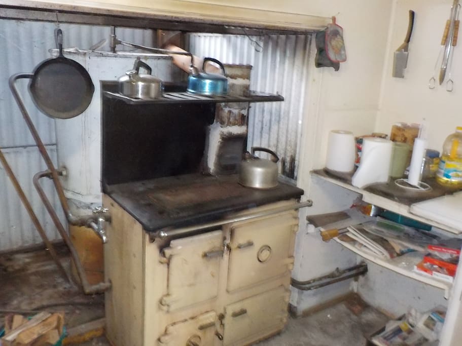 Combustion stove used for cooking, warming and heating water