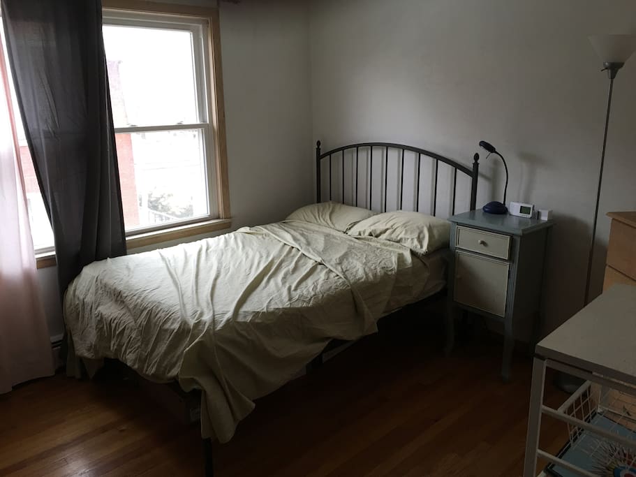 Room & Board iron bed, and a set of drawers + a closet for long-term stays!