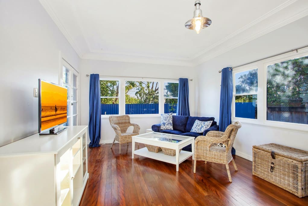 Main living area. Tv, lounge, extendable dining table and kitchen.