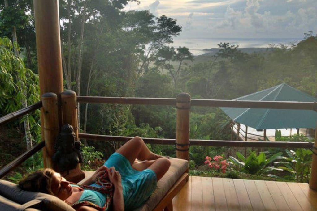 View of jungle, pacific ocean, and our stunning floating yoga deck from main house!