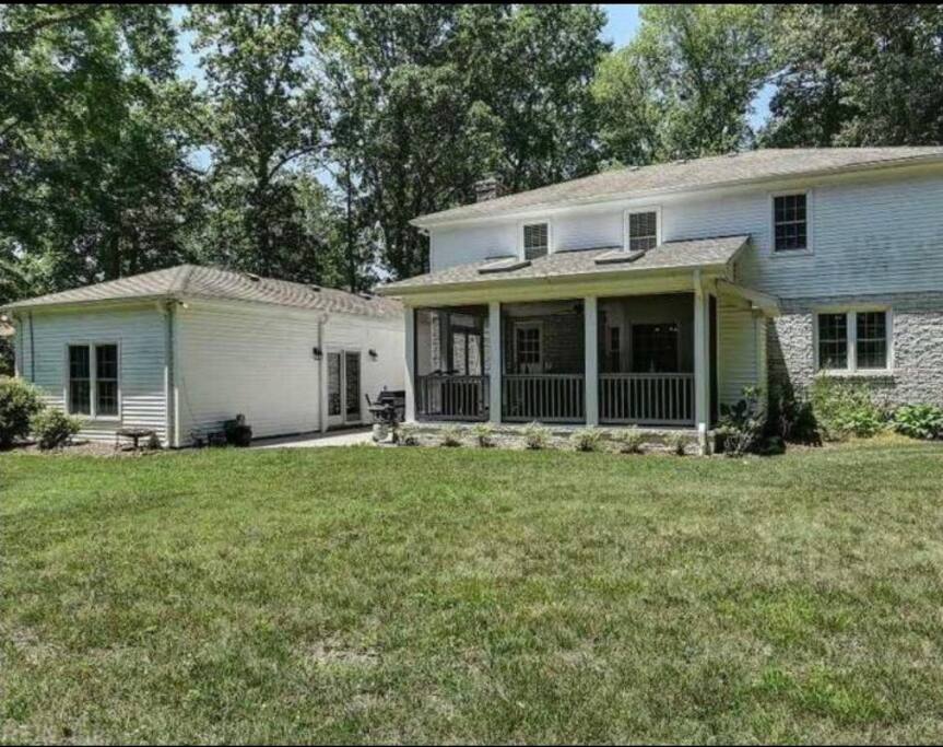 Guests have access to patio and backyard. Guest suite is located on left in photo and screened in porch is on the right.