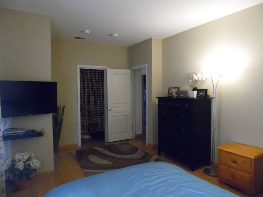 master bedroom with cable TV and DVD player.