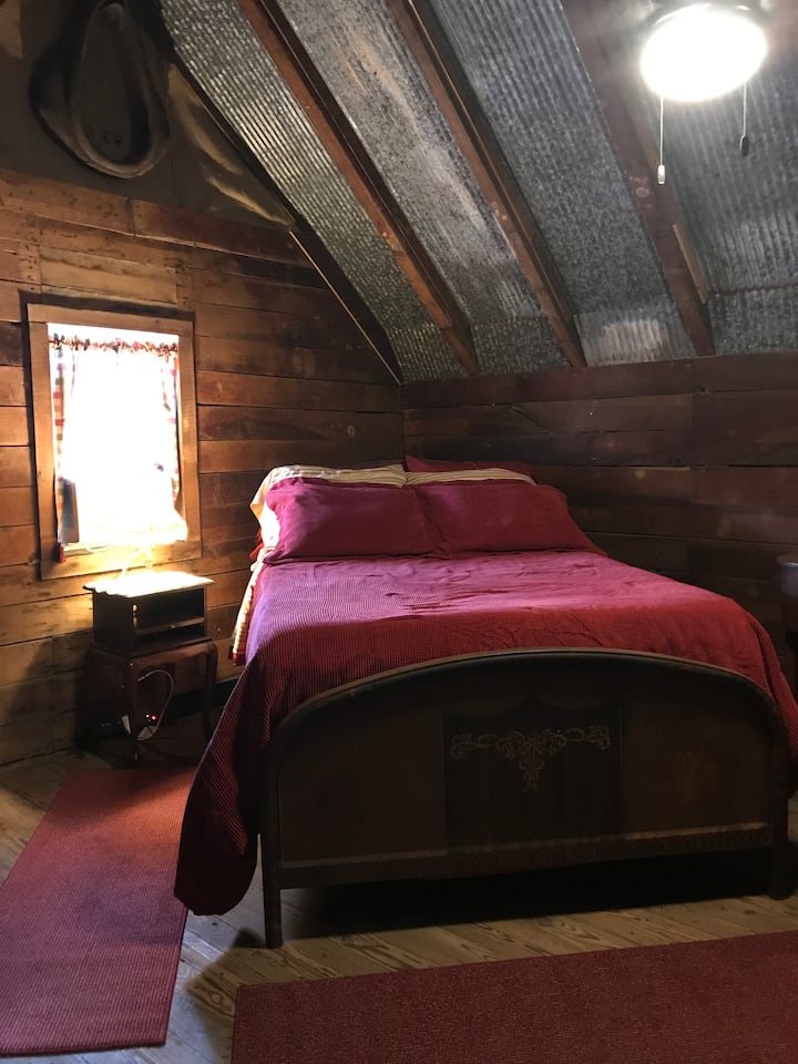 Main loft bedroom with a full size bed