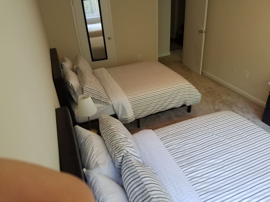 two full size beds in the bedroom