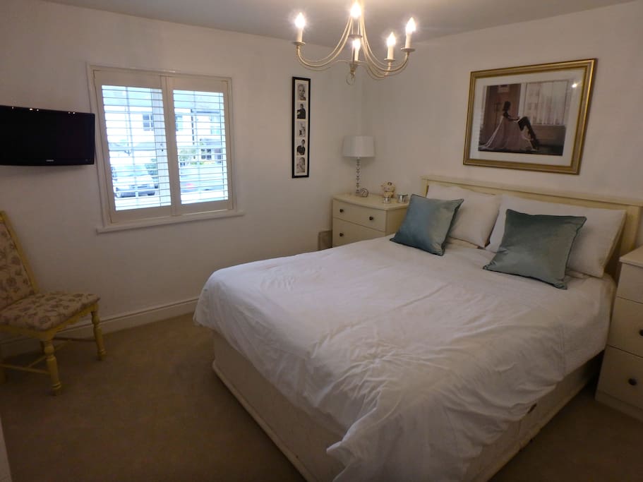Master bedroom with wall mounted TV, high quality King size bed and luxury bed lining plus lots of wardrobe space