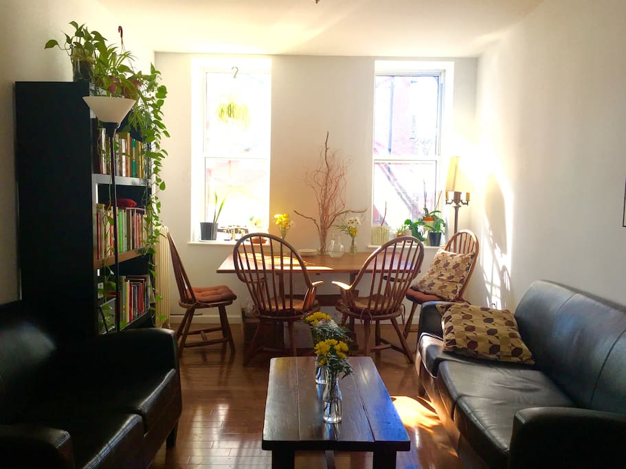 Spacious living room with large sun soaked table