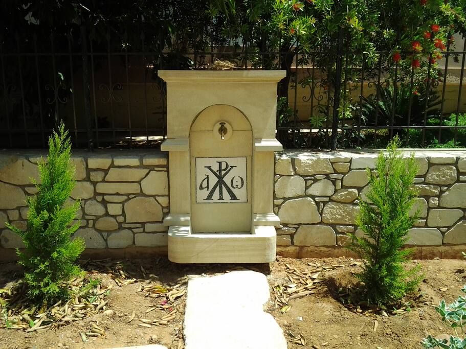 stone fountain with mosaic construction of our 15 year old son