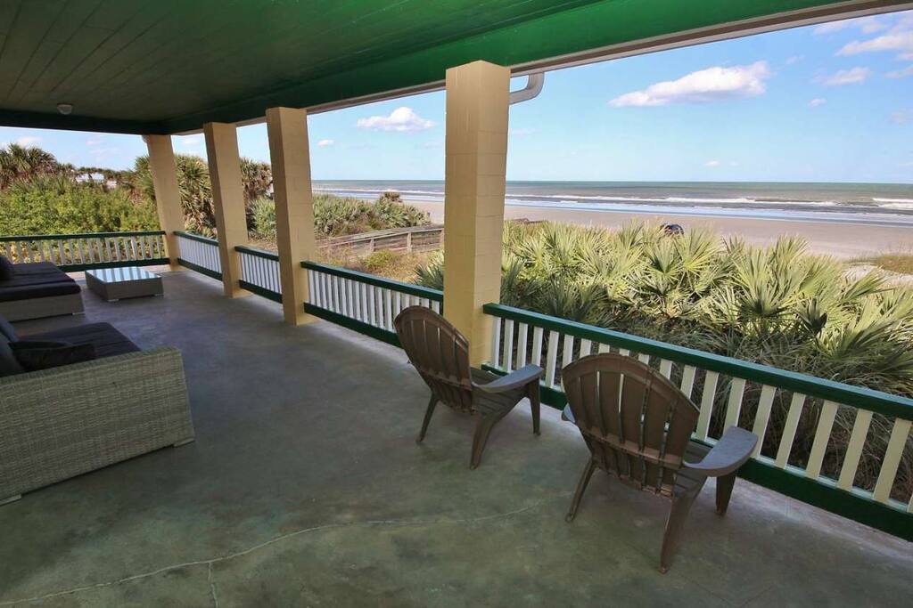 Watch the people at the beach from the comfort of your private veranda